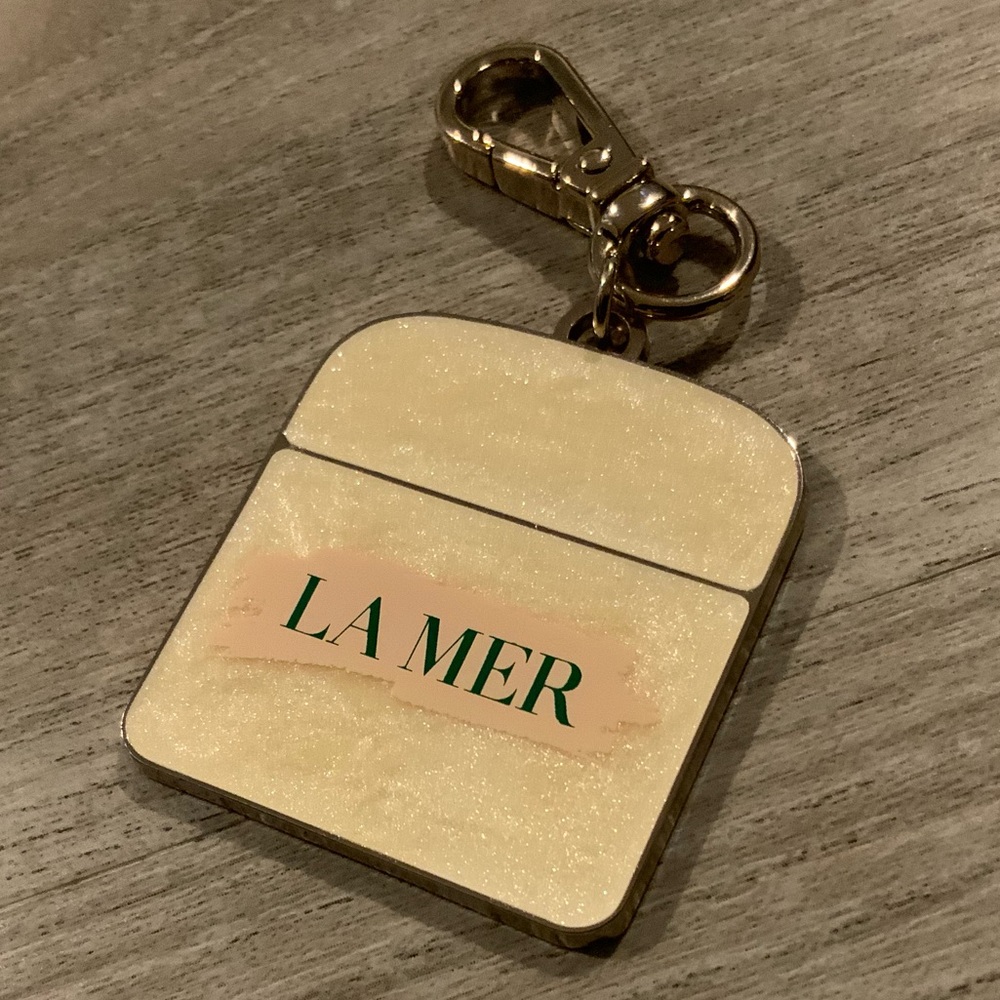 La Mer Cream and Gold Keychain